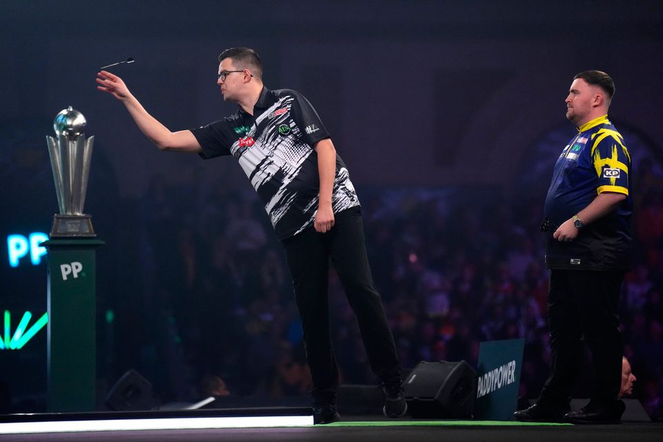 Gian van Veen in action against Luke Littler in the final of the World Darts Championship at the Alexandra Palace: John Walton/PA Wire.